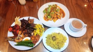 Cafe BLD Nasi Kandar full plate of Chicken 65, Honey Chicken, Ayam Bawang, Baked Prawn, Cabbage shreds with turmeric, green chilli, okra, half salted egg beside the Nasi Kabuli, a plateful of Pasembur and a cup piping hot Teh Tarik 