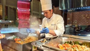 Chef Jo Aphilak, Executive Sous Chef from Amari Pattaya, making the Thai favourites, Pad Thai with River Prawn