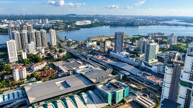 JOHOR BAHRU PHOTO The Heart of Southern Growth — An aerial view of Johor Bahru city centre and its surrounding cross-border connectivity infrastructure. Over the past 20 years, Iskandar Malaysia has transformed from a regional development corridor into a dynamic economic ecosystem contributing nearly 70% to Johor’s economy.